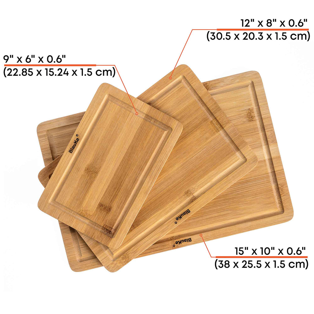 https://blauke.com/cdn/shop/products/BambooCuttingBoardSetof3_OrganicKitchenChoppingBoardsforMeatCheese_Vegetables_HeavyDutyBambooCuttingBoardswithJuiceGrooves_Handles_WoodenServingTray_CarvingBoard-4.jpg?v=1678473482&width=1090
