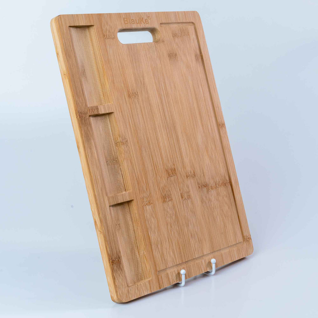 https://blauke.com/cdn/shop/products/WoodenCuttingBoardsforKitchen_ExtraLargeBambooCuttingBoardwithContainers_LargeWoodCuttingBoard-13.jpg?v=1678542100&width=1090