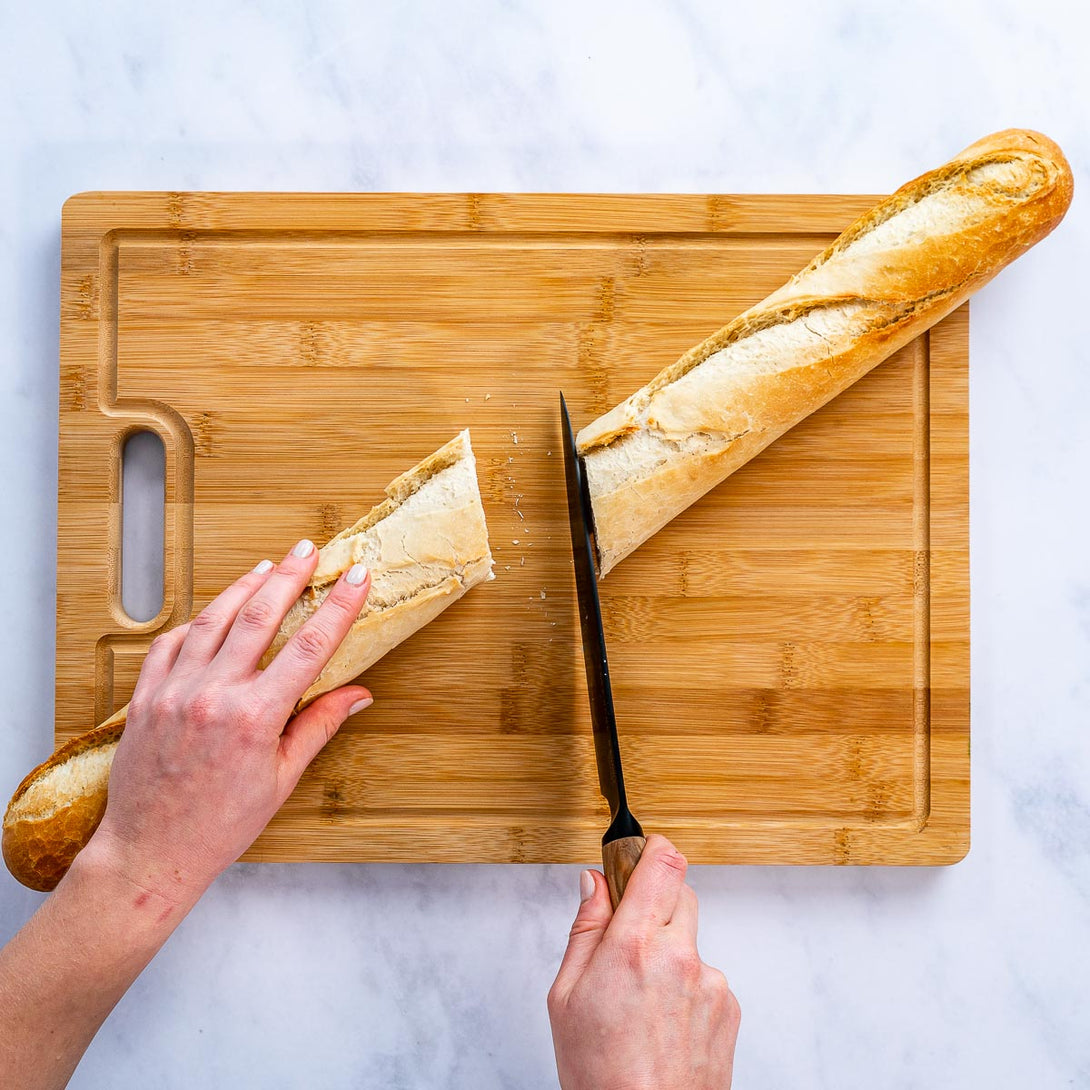 https://blauke.com/cdn/shop/products/WoodenCuttingBoardsforKitchen_ExtraLargeBambooCuttingBoardwithContainers_LargeWoodCuttingBoard-20.1.jpg?v=1678542100&width=1090